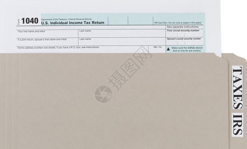 灰色文件夹内的个人所得税表格收的商业金融概念图片