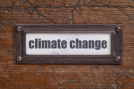 气候变化档案柜标签铜持有者与冷冻和刮碎的木材对照图片