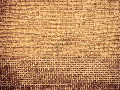 棕色网状材料天然粗蓝生态背景上的黄麻袋带背景图片
