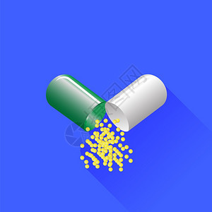 绿药丸在蓝背景上孤立长阴影图片