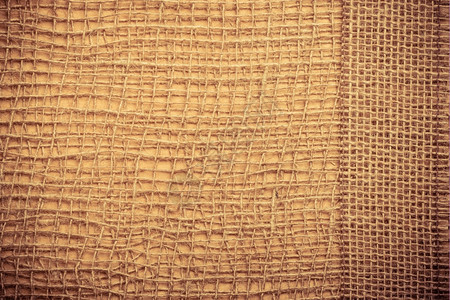 棕色网状材料天然粗蓝生态背景上的黄麻袋带背景图片