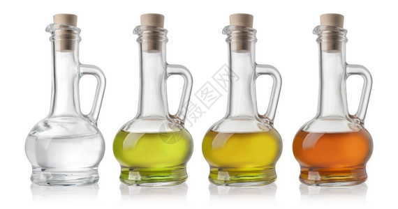 白色背景的油和醋玻璃瓶图片