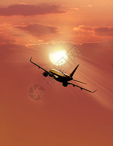 大型飞机在日落时空飞过图片