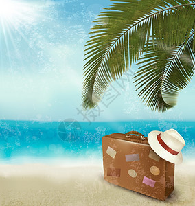 手提箱和帽子美丽海边背景图片