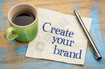创建你的品牌忠告在餐巾纸上写笔迹加一杯咖啡图片