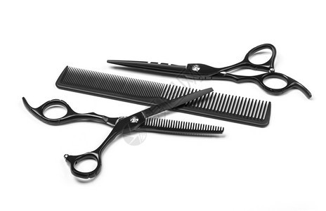 白色背景上隔离的剪刀和梳子专业理发师图片