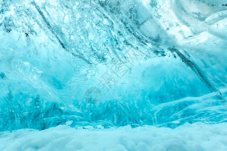 位于VatnajjokullGlacierJokulsarlonNationa公园的冰岛洞穴墙壁背景图片