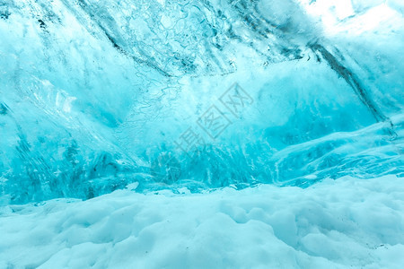 位于VatnajjokullGlacierJokulsarlonNationa公园的冰岛洞穴墙壁背景图片
