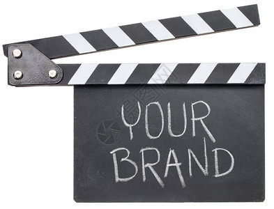 您的品牌电影标题白粉中的文字手拍板上的文字孤立在白色上图片