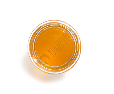 白色背景上隔绝的玻璃罐蜂蜜图片