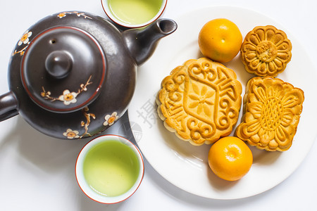 秋节的月饼和茶叶白隔绝复制空间图片