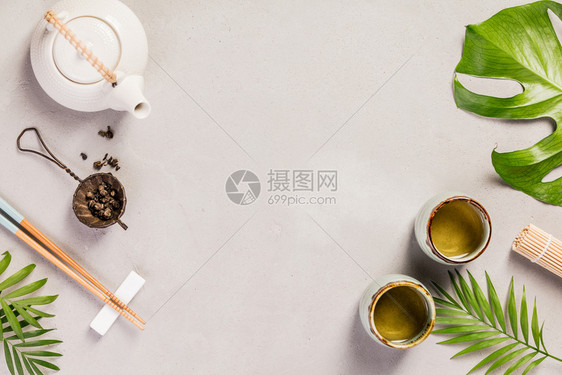 亚洲食物背景灰水泥背景的茶叶和筷子顶视平板亚洲食物背景亚洲食物背景图片