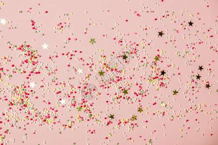 金星喷洒和冰淇淋在粉红色节日背景庆祝概念顶层景色平地图片