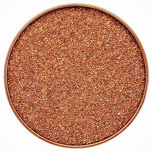 圆木质盘中免费的红quinoa谷物图片