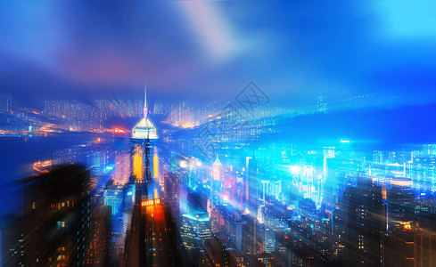 虚拟城市数字香港中心与维多利亚港的放大运动效果智能城市金融区在技术概念上天桥和高楼建筑夜间空中观景图片