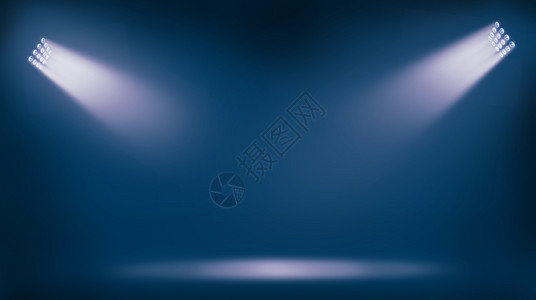 蓝色背景的足球体育场灯反光器图片
