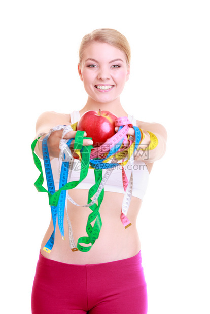 健康保生活方式运动健康的女适合运动拥有许多彩度量的磁带和水果女孩这些带和水果在白色上被孤立图片