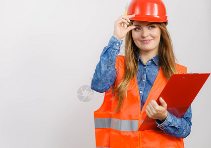 妇女建筑工人结构程师穿橙色背心红头盔有笔文件垫工业作安全室拍摄灰色女工程师建筑头盔图片