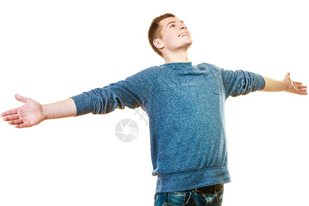 成功的积极情感幸福自由快乐的年轻男人成功的小伙子举起双臂向上看孤立在白色背景上图片