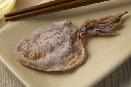 日本干烤炒鱿鱼零食背景图片