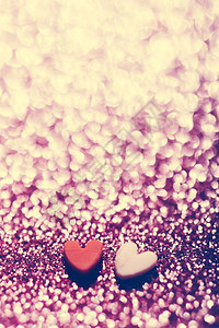 粉红闪烁背景的两颗心情人节和日庆祝爱情浪漫背景粉红闪烁背景的两颗心图片