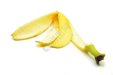 白色背景孤立的黄香蕉皮图片
