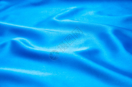 平滑优雅的蓝色丝绸可用作背景图片