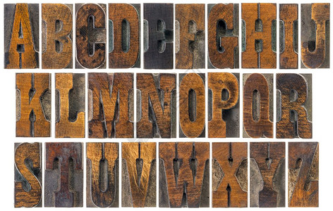 古老的纸质印刷木制块西部电影和纪念品中流行的法国克拉伦登字体共26个孤立字母的拼图背景图片