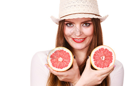 具有吸引力的长发女子的多彩双眼化妆将两半的葡萄果柑橘水握在手中健康饮食品暑假概念妇女将两半的葡萄果柑橘水握在手中图片