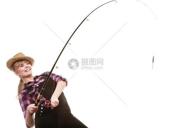 快乐的戴太阳帽子女士拿着钓鱼棒在时玩得开心快乐的戴太阳帽子女士拿着钓鱼棒图片