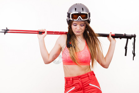穿戴头盔护目镜的年轻滑雪少女冬季运动最能放松健身概念妇女举起滑雪杆图片