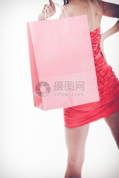 穿着红色短裙的女孩拿着购物袋图片