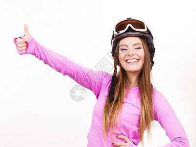 冬季运动者概念戴头盔的妇女穿着粉红色运动服的年轻女士戴运动头盔的妇女图片