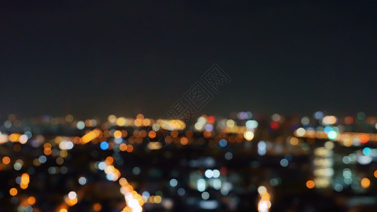城市摩天大楼的布基背景灯光照亮夜里闪的照片图片