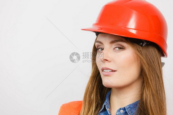女建筑工人结构程师穿戴红色硬头盔工业作安全室中戴头盔的女工程师建筑图片