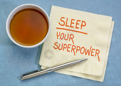 睡觉你的超级大国概念手写在餐巾纸上加一杯茶图片
