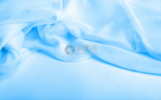 抽象蓝丝织布背景图片