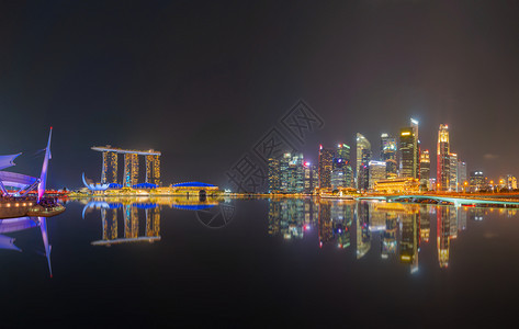 新加坡市中心夜里有反省金融区和亚洲技术智能城市的商业中心天梯和高楼大图片