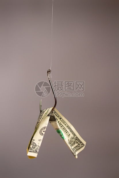 鱼钩的概念图象挂着美元钞票的鱼钩被吊上诱饵图片