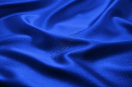 平滑优雅的蓝色丝绸可用作背景图片