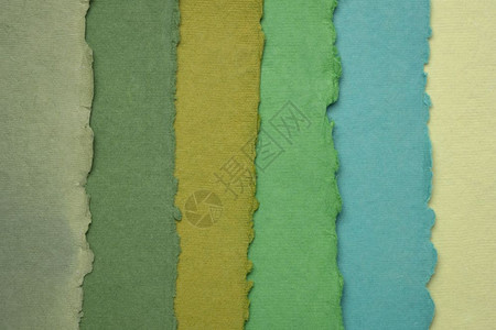 从回收的棉花布料中以蓝色和绿调制成的手工印度纸收集图片
