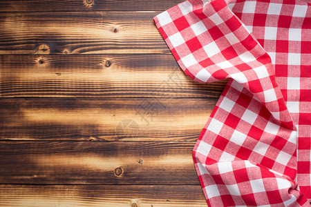 粗制木板桌背景顶视图的餐巾布或桌图片