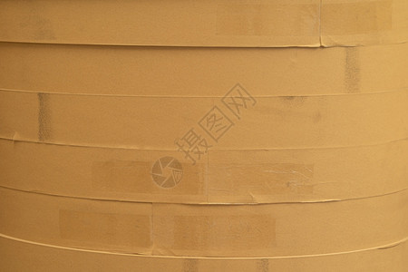 卷纸筒工业制造厂的纸管芯组织质棕色卷的原始产品材料库存车间仓的纸板圆筒货物模式纹理背景