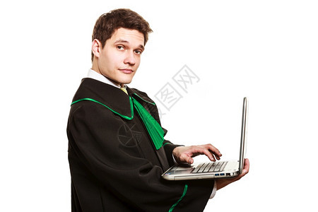 年轻的男律师在线拥有膝上型计算机帮助年轻的男律师拥有膝上型计算机图片