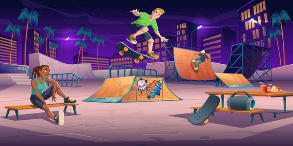 夜间公园玩滑板的青少年图片