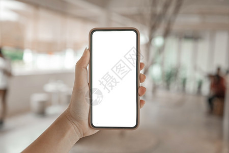 妇女手握机电话空白复制间屏幕智能手机与空白屏幕隔离智能手机与技术概念隔离图片