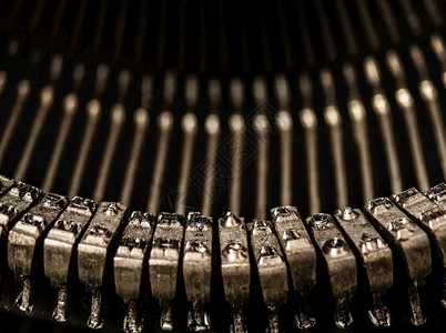 旧打字机的金属母背景图片