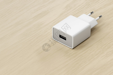 USB充电线木制桌上USB端口的智能电话平板或其他电子设备充器背景
