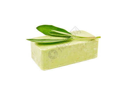 在白色背景上被隔离的绿色肥皂配有白种子螺旋丝的绿色肥皂图片