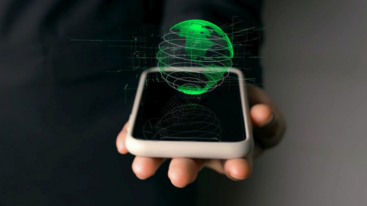 人类手持具有地球全息技术的移动电话人类手持具有地球全息技术的移动电话人类手持地球全息技术的移动电话图片